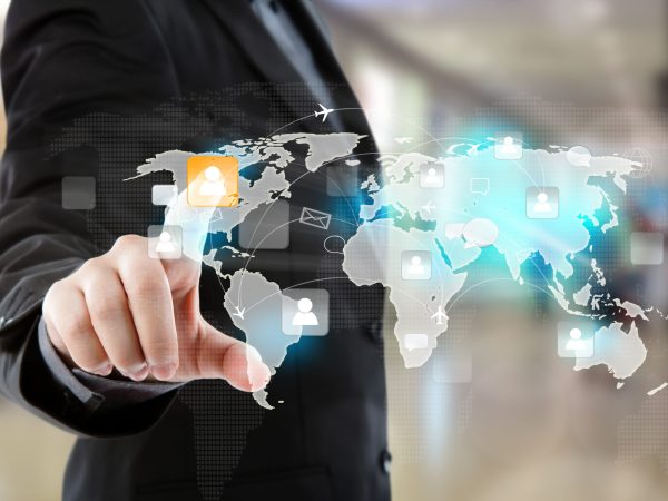 Social Network concept : Business man point to social network a Social Network concept : Business man point to social network and world map